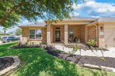 Attractive curb appeal with extended porch and upgraded brick flooring.