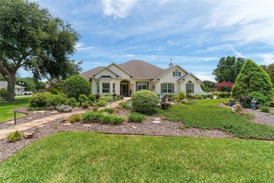 Front of home showing walkway and closer view of gardens