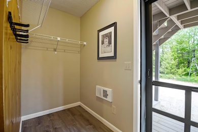 Spacious mudroom with new flooring.