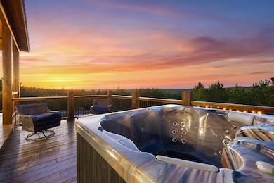 Deck at dusk with a hot tub