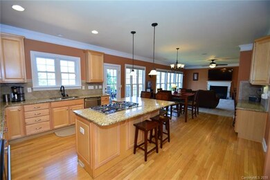 Large kitchen looking into Living room. Granite & 