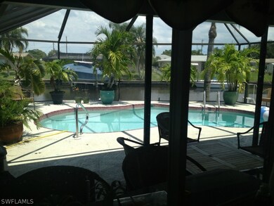 Kitchen overlooks pool and canal