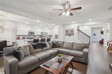 Living room with dark hardwood / wood-style floori