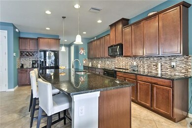 Granite Countertops, Black Appliances, and Built i