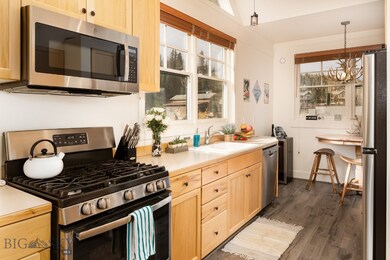 Kitchen featuring light brown cabinets, sink, hang