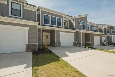 View of property with a garage