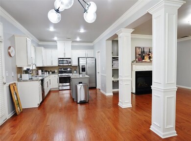 Kitchen featuring stainless steel appliances, dark