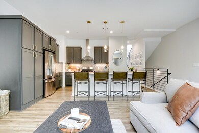 Spacious design connects the kitchen, dining, and living areas for seamless entertaining.