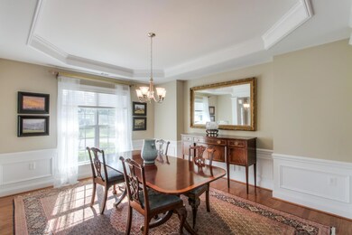 Formal Dining Room with trey ceiling and extensive molding.