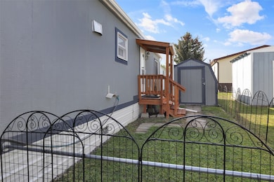 Fenced yard with a gate and a shed
