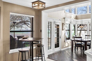 Dining area with dark hardwood / wood-style floors
