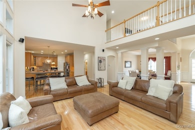 Living room featuring light wood-style flooring, a