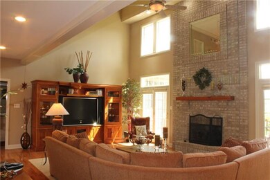 The 19-foot high great room is warmed by a floor-t