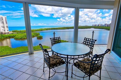 Sunroom featuring a healthy amount of sunlight and a water view
