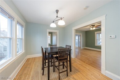 Dining room with light hardwood / wood-style floors and ceiling fan