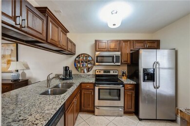 Kitchen with granite countertops and stainless ste
