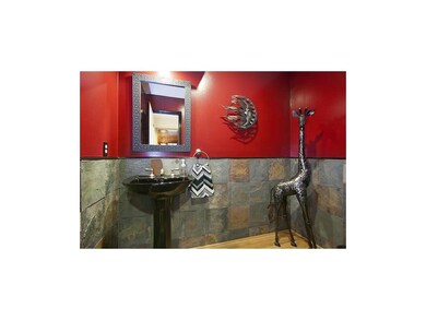 Handsome slate tiles in the powder room.