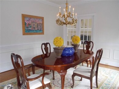 Dining Room with wood floors on the diagonal. Open