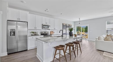 Kitchen with appliances with stainless steel finis