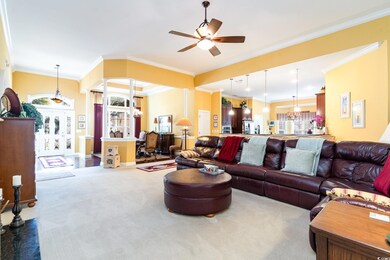 Family Room consists of 12' ceilings, ceiling fan,