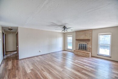 Unfurnished living room with wood-type flooring, a