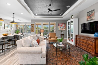 Tray ceiling highlights the living room.