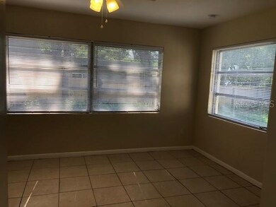 CHARMING FLORIDA ROOM. WINDOWS ON THREE SIDES OVER