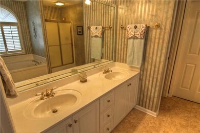 Master bath has double vanities and whirlpool tub. 