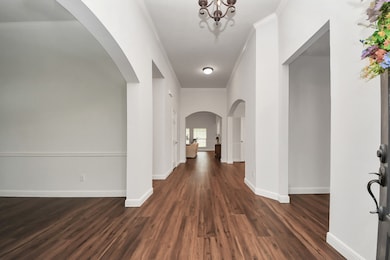 A spacious, inviting entryway with high ceilings,