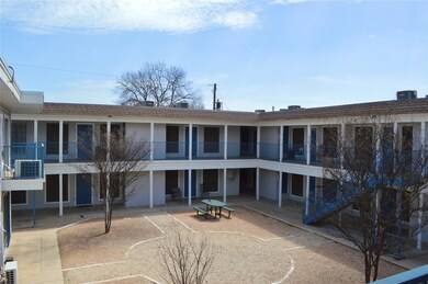 View of building exterior featuring stairs and ce