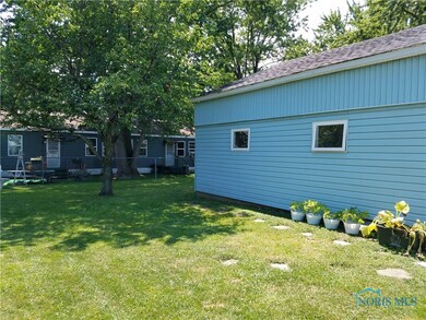 Side of Garage and yard view.