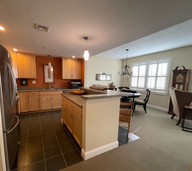 Kitchen features large island.