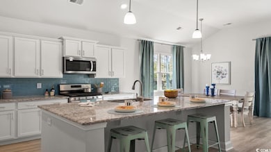 Kitchen featuring appliances with stainless steel 