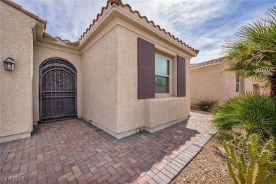 Entrance to property featuring a tiled roof and st