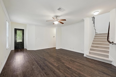 Unfurnished living room featuring dark wood-style