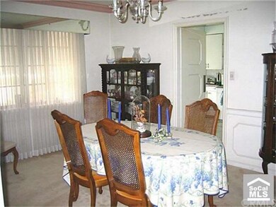 Formal dining room is classy and very usable