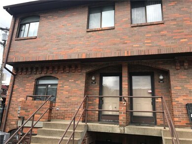 Entry to two story brick townhome in heart of Oakl