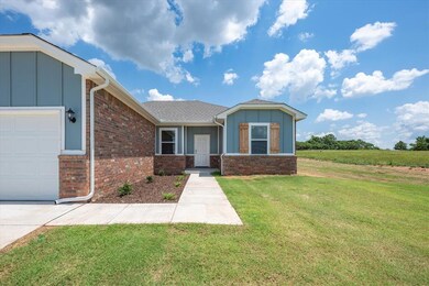 View of front of property featuring a garage and a