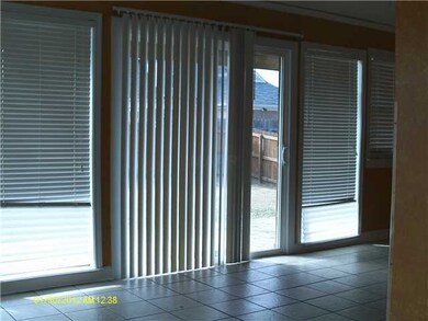 Dining room/emclosed sun porch area with wall of w