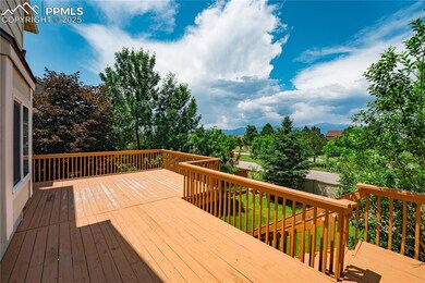 Rear view of property with stairs and a deck