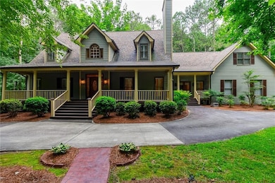 View of front facade with covered porch, curved dr