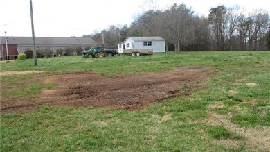 Location close t everything yet seems like the country with 2.73 acrees two outbuildings