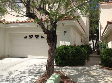 View of side of home with stucco siding, a garage,