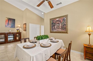 Dining room featuring high vaulted ceiling, a ceil