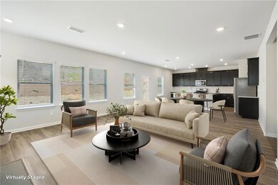 Living room featuring light wood-style floors and recessed lighting