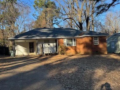 Single story home with a carport