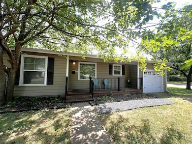 Ranch-style house featuring covered porch, an att