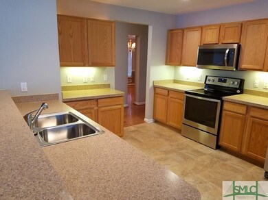 Updated kitchen has tons of cabinets and counterto
