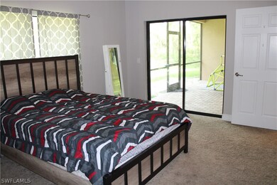 Master bedroom with sliders to the lanai.