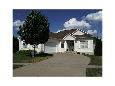 Front Exterior. Side-load-entry garage adds charac